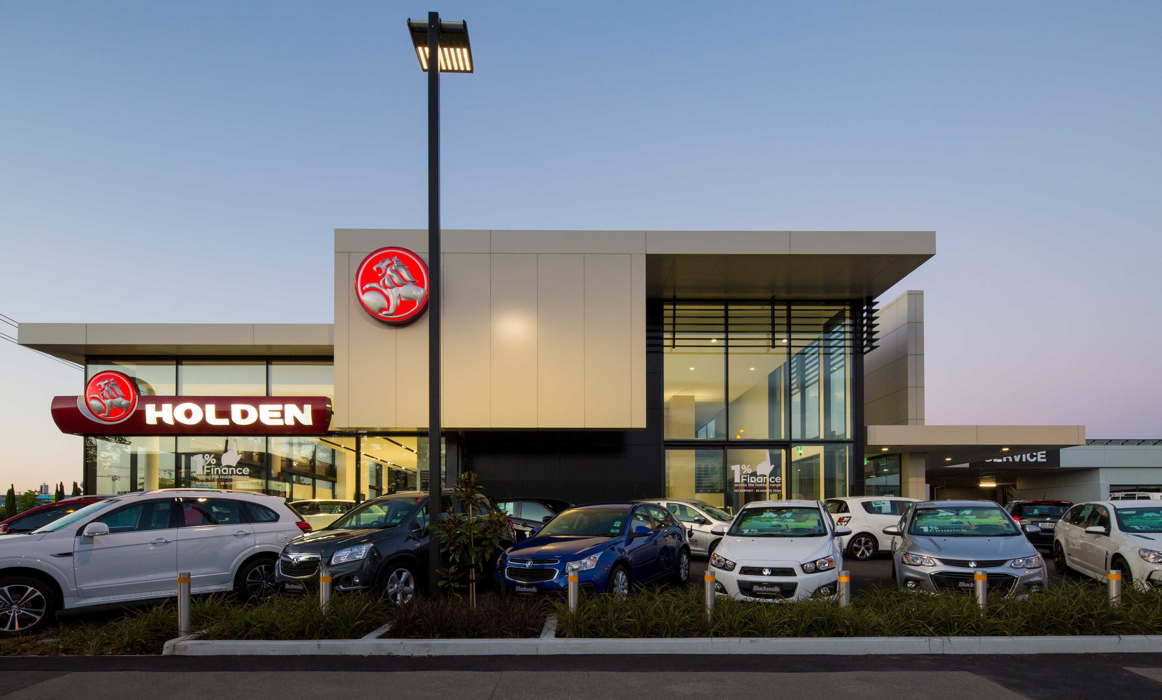 Blackwells Holden frontage at dusk with Holden cars in the foreground